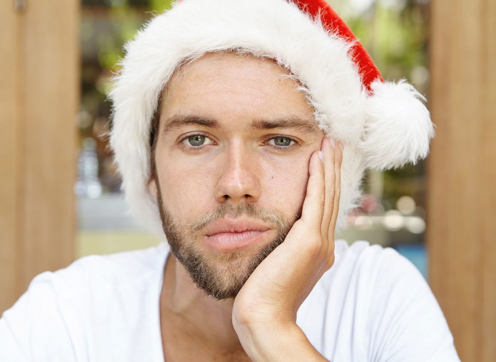 sad man with santa hat