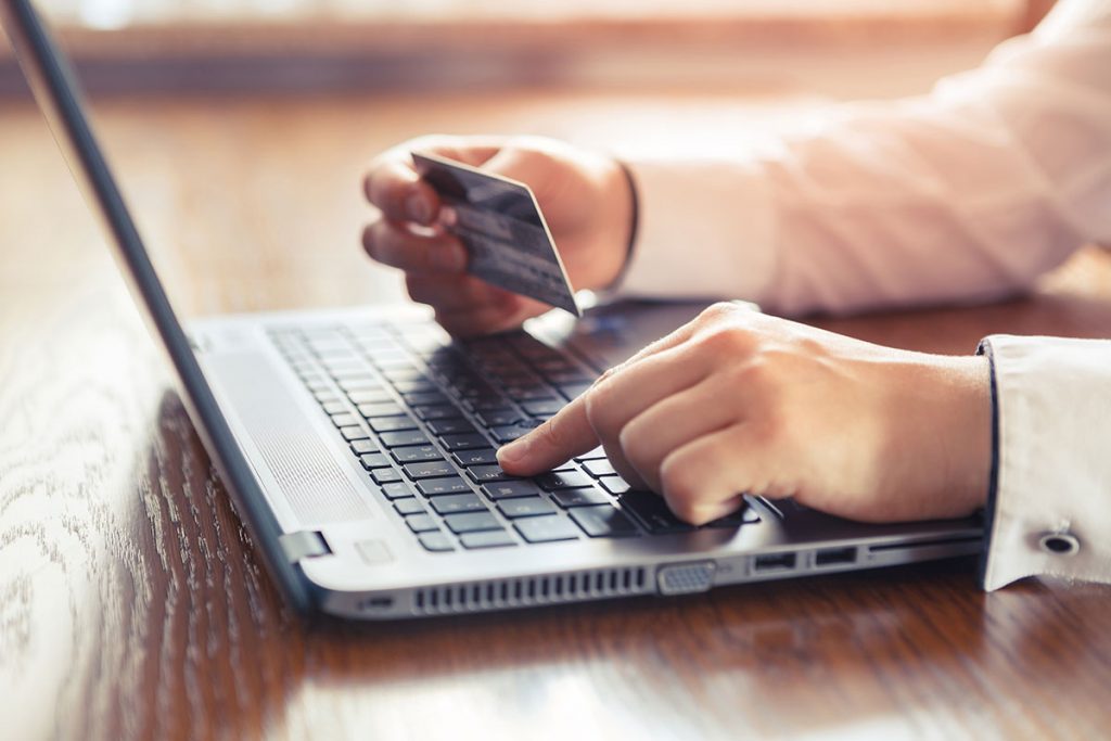 photo of someone purchasing something on a computer