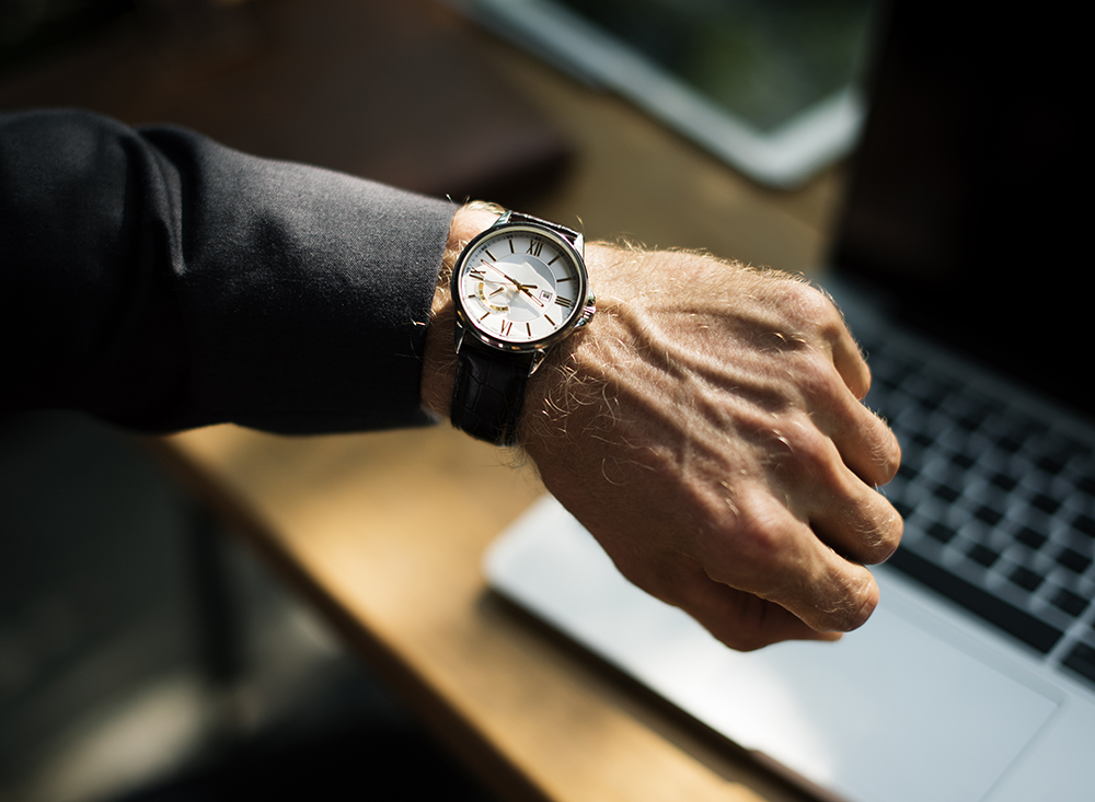 someone looking at watch because their site is slow