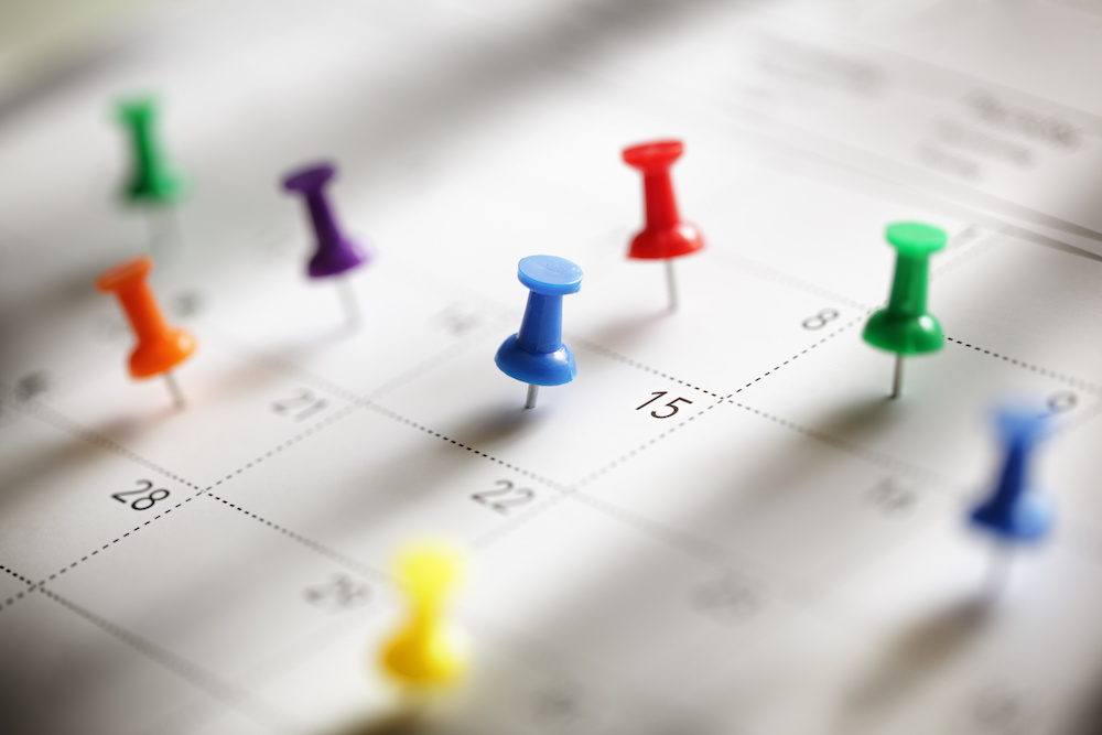 thumbtacks on calendar