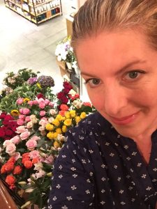 photo of Jill Anne Miller and flowers