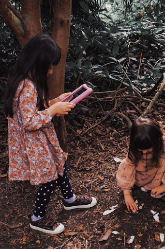 girls playing with ipad
