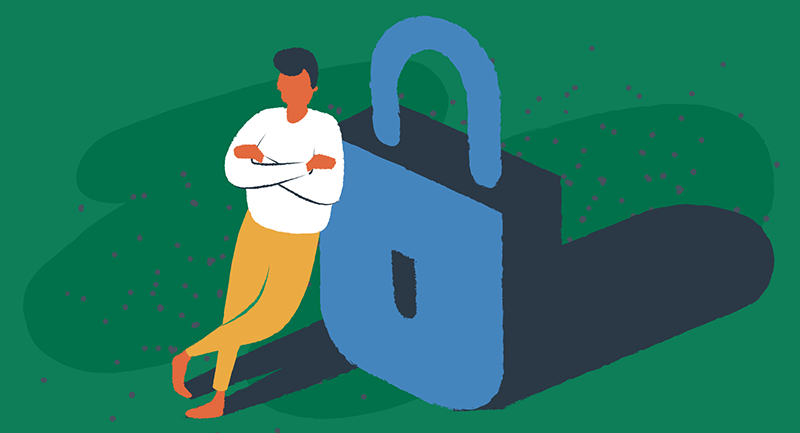 man leaning against a large padlock