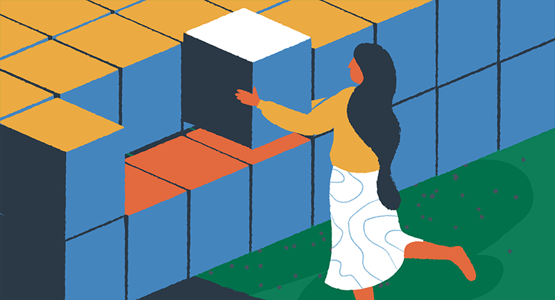 woman stacking blocks