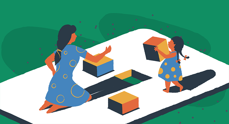 woman and child building with blocks